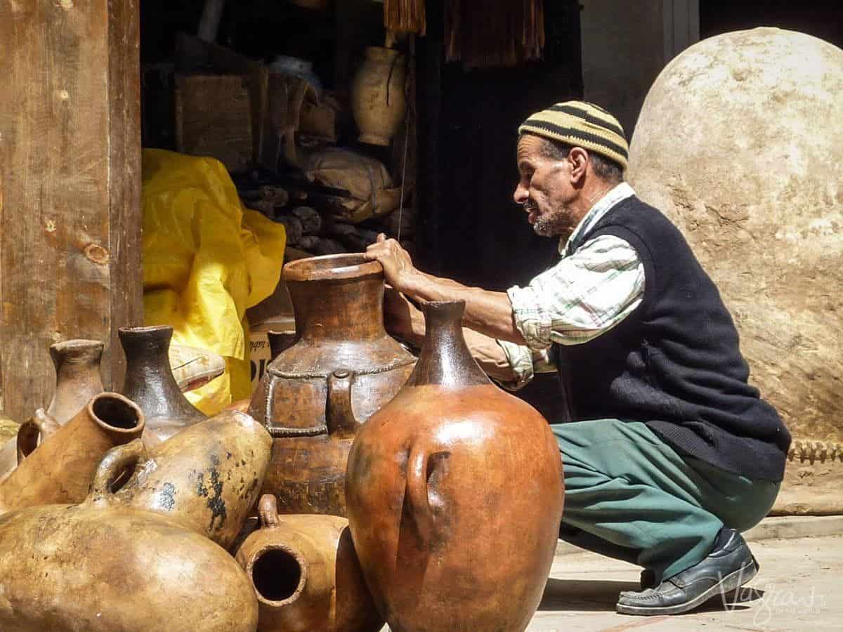 Marrakech Souk Morocco. Is Marrakech safe. Beware of scammers altough this man is just selling pots