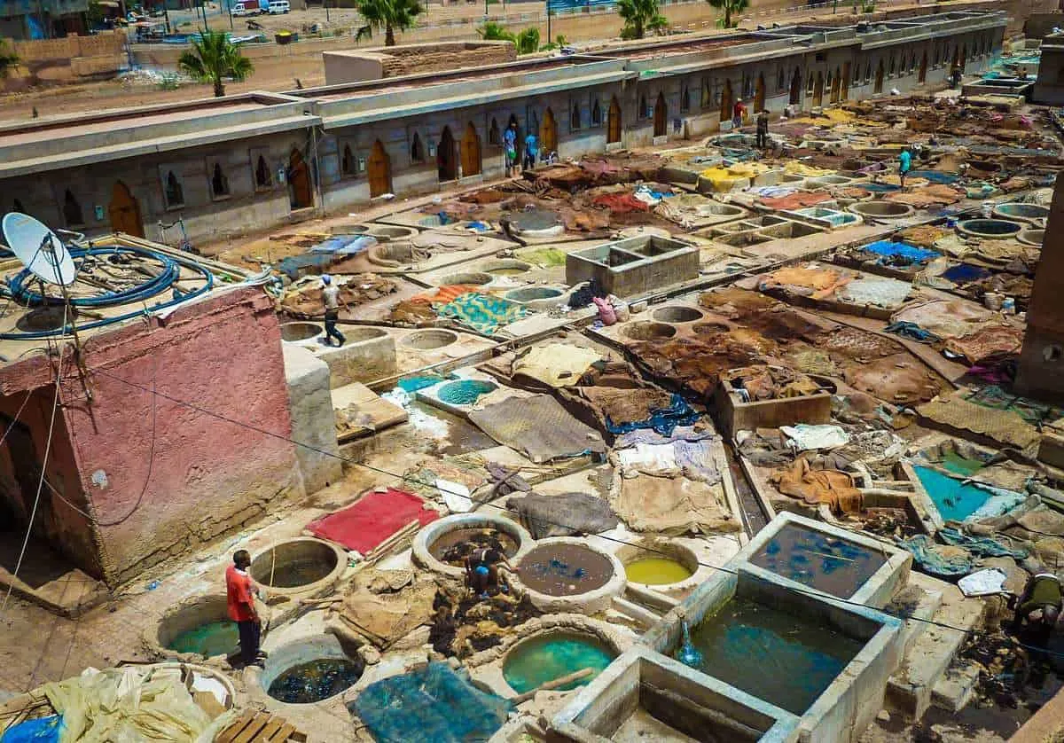 Tannery ponds and workers Morocco. Best free things to see and do in Marrakech Morocco