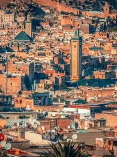 What is Fez Morocco like? This view looking over the ancient city of Fez reveals the ancient and dense urban sprawl of the Fez Medina.