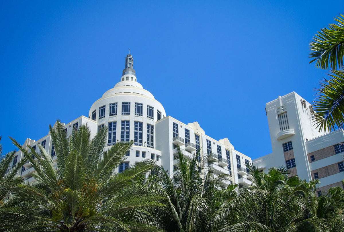 Art Deco buildings and palm trees in Miami.