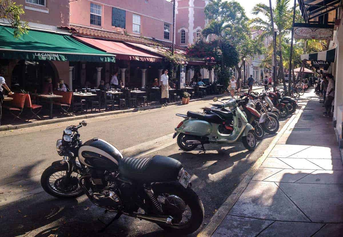 Motorbikes parked along a restaurant street in Espanola Way Miami. 