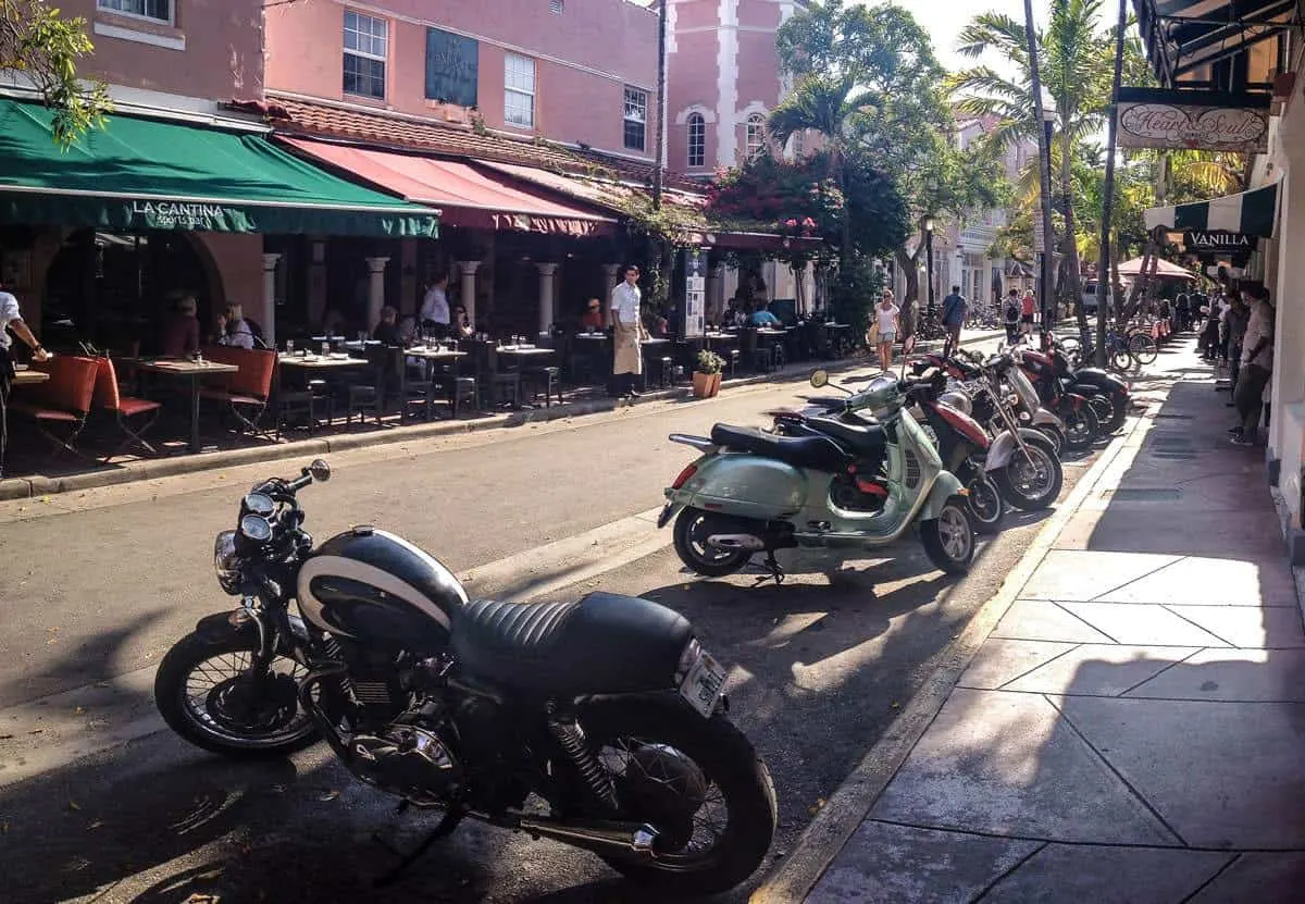 Motorbikes parked along a restaurant street in Espanola Way Miami. 