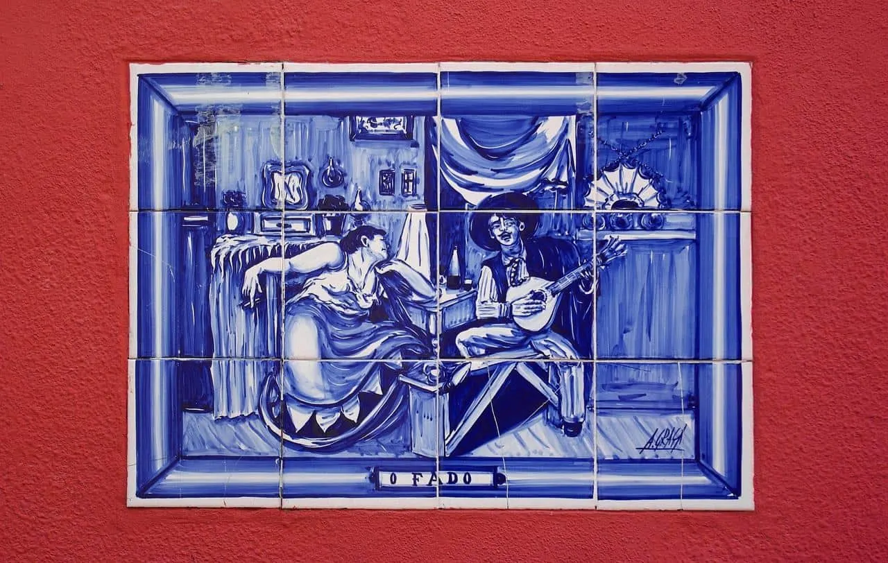 Typical hand painted Portuguese azulejo tile depicting a fado scene in Lisbon. 