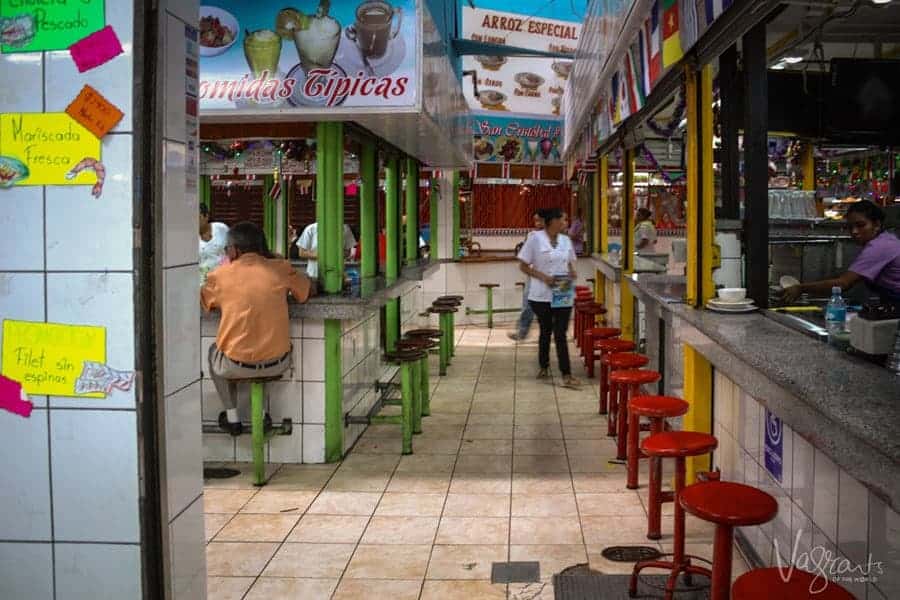 Colourful stool line the cafes at the Central Markets in San Jose Costa Rica.