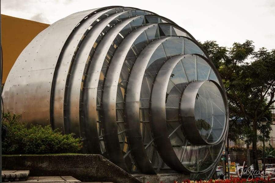 A large circular metal building with glass front in San Jose. 