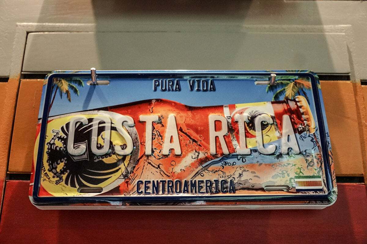 Costa Rica number plate with retro beach and beer design. 