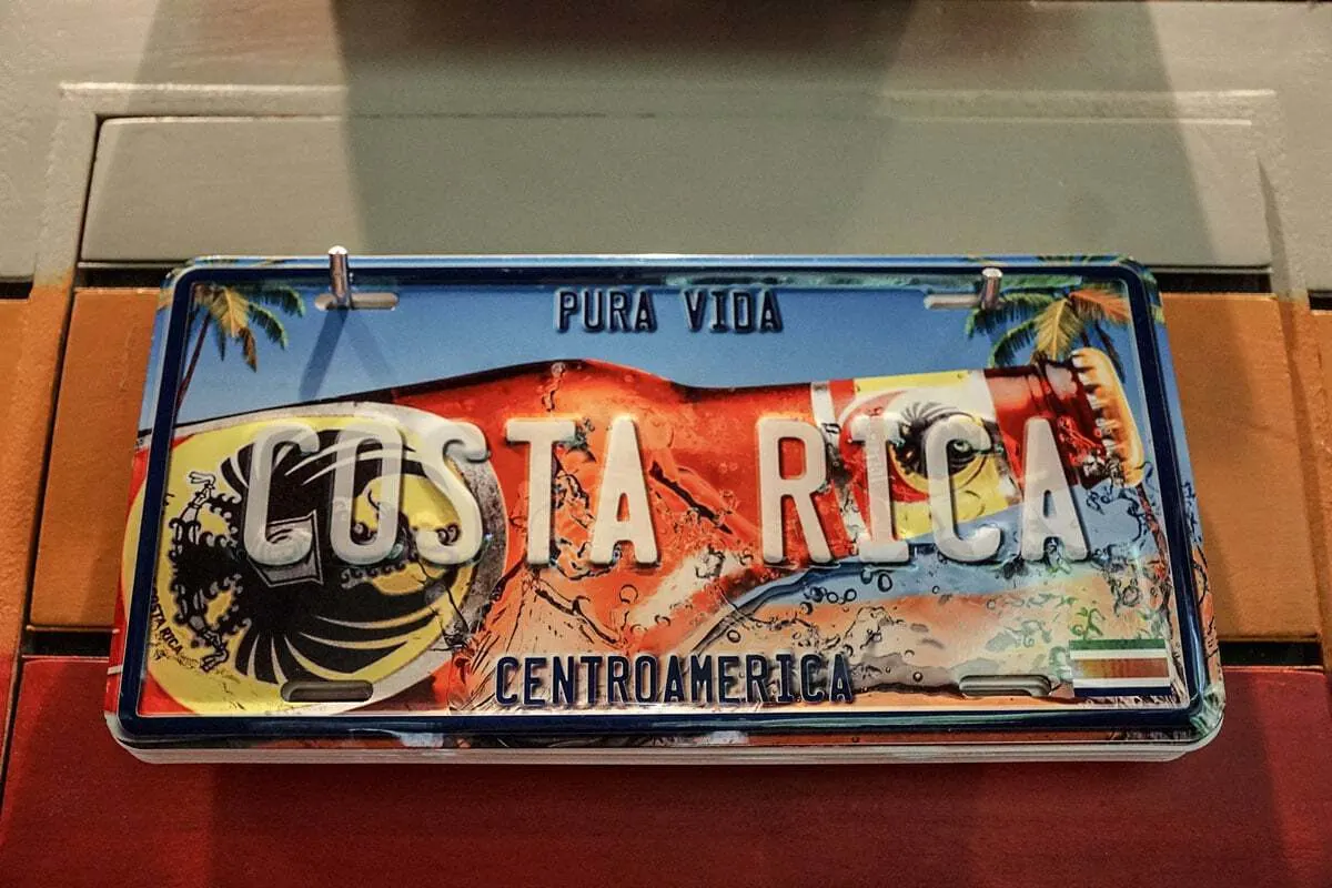 Costa Rica number plate with retro beach and beer design. 