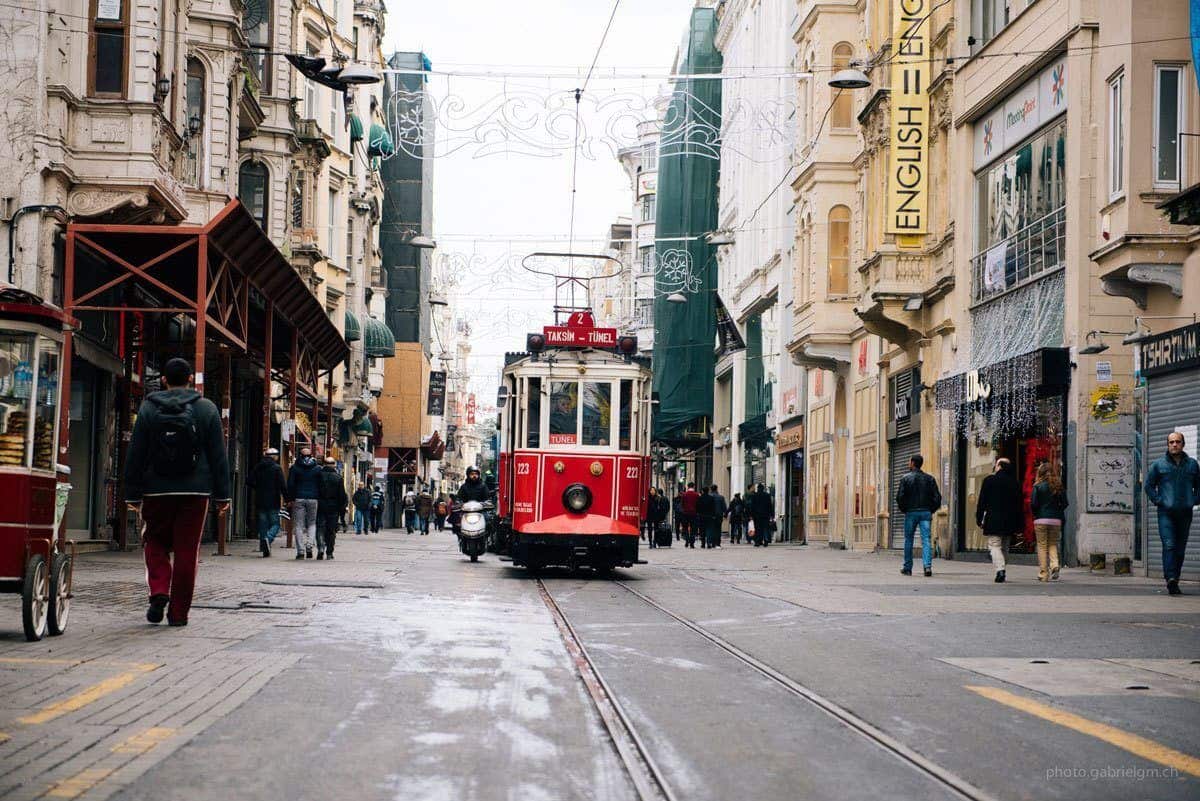 The famous red tram heading down the centre of pedestrian street in Taksim.