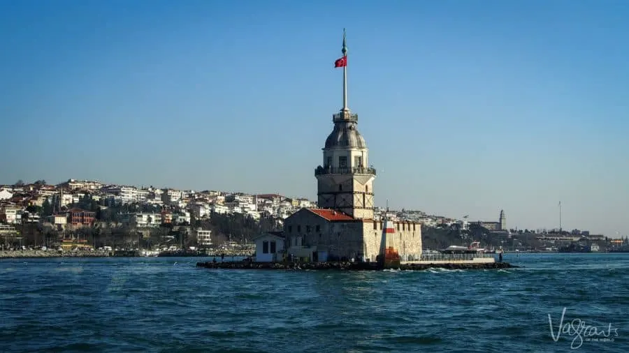 A small island and church float in the middle of the Bosphorus river. 