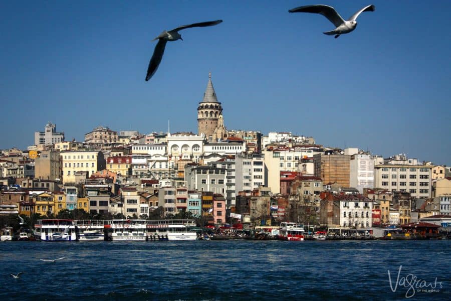 Istanbul city from a Bosphorus boat tour. Galata tower rises above the city skyline. 