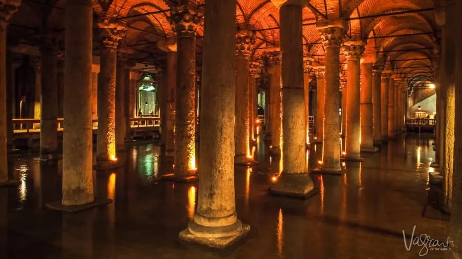 The dimly lit columns rising from the water in the Basilica Cistern.