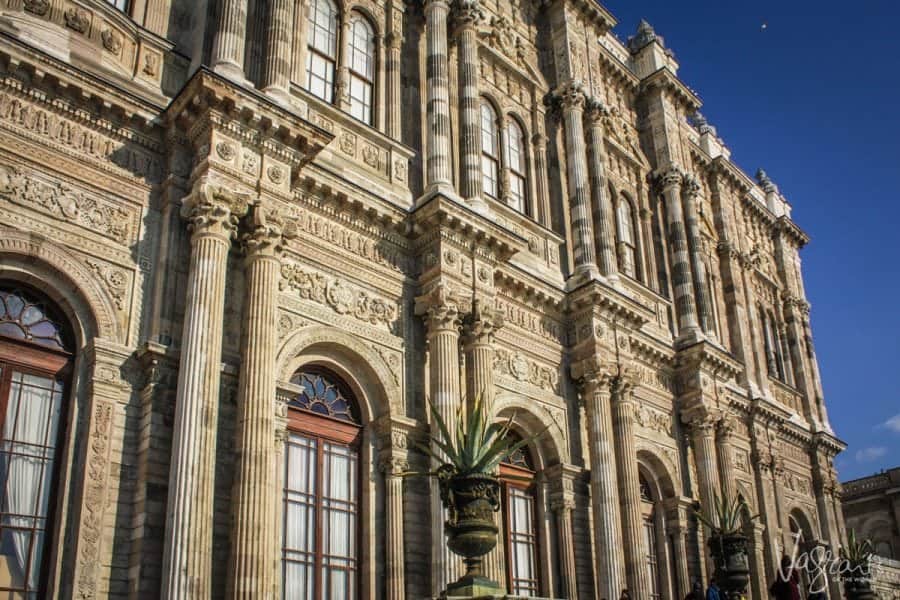 Close up view of the windows and carved columns on the Dolmabahçe Palace exterior. 