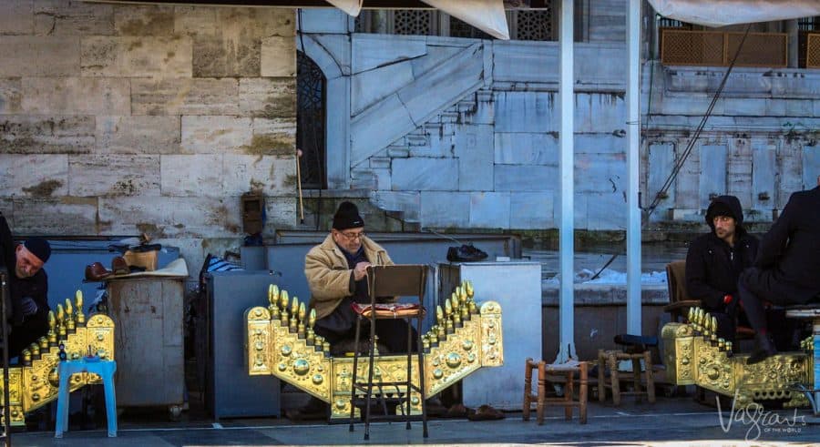 Turkish shoe shine men with their golden organ shaped shoe shining platforms. 