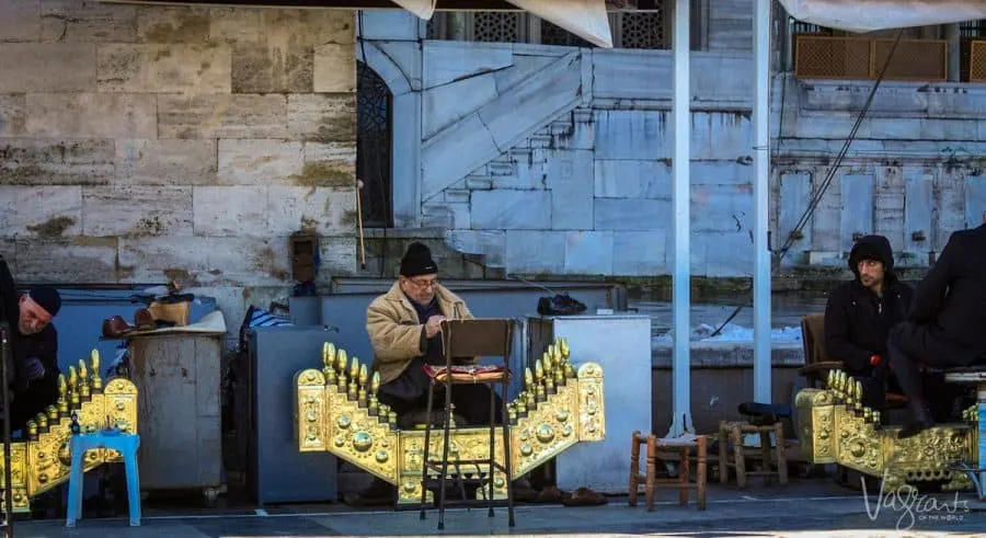 Turkish shoe shine men with their golden organ shaped shoe shining platforms. 