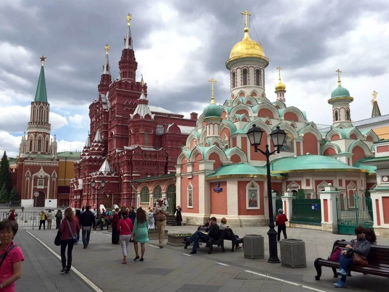 Red Square Moscow Russia with the Kremlin and church of christ the saviour. These are the places are the reason why you should go to moscow. This is a photo of people walking towards two great moscow tourist attractions