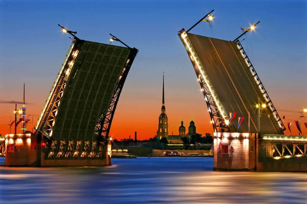 An open bridge during the white nights celebrations in St Petersburg. The white nights celebrations are the best things to do in St Petersburg at night but only in summer.