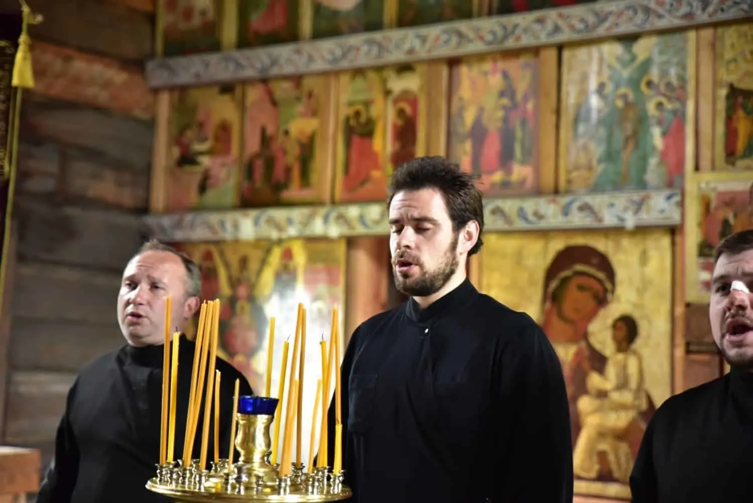 3 men singing in a church on Kizhi Island Russia. viking river cruises provide unique opportunities to live like a local for a short while whilst on their river cruise in russia