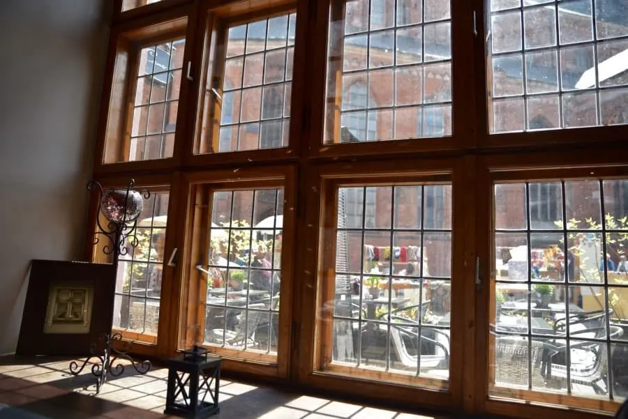 Looking out windows onto a courtyard in Old Town Riga. Where is Riga, a question often asked. It is the capital of Latvia in Northern Europe.