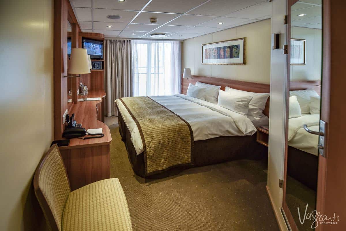 stateroom with double bed and balcony on a viking river cruise 