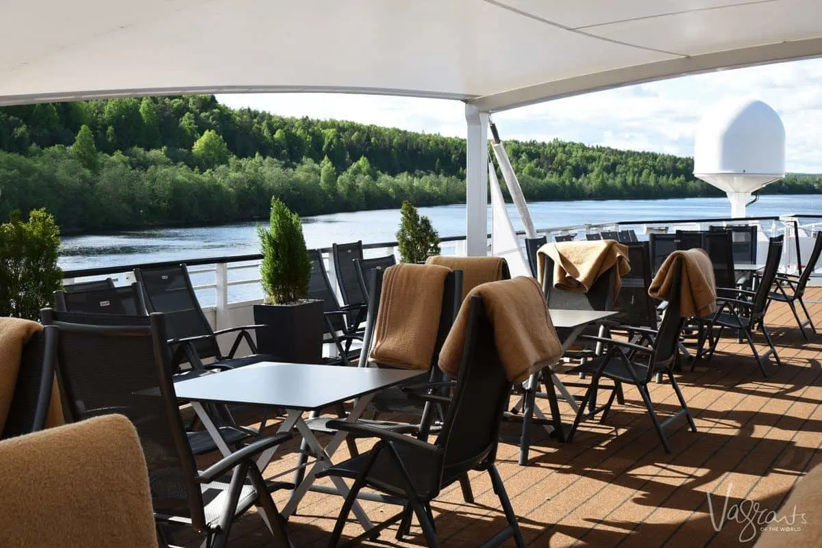 viking river cruise boat deck with tables and chairs.  luxury cruising through russia on a viking river cruise st petersburg to moscow