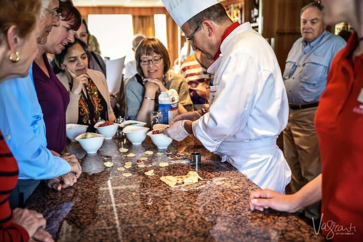 chef showing viking river cruisers how to make a typical russian dish on their cruise st petersburg to moscow