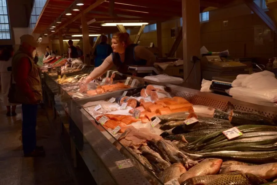 Lady selling fresh fish in The Central Market Riga, Latvia. Best place to eat in Riga.