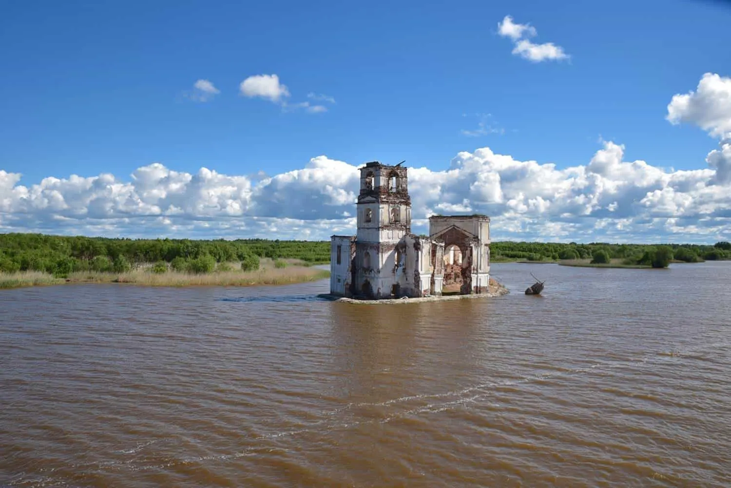 abandoned church in the middle of the river.  one of the unique things you will see on a Waterways Of The Tsars. St Petersburg to Moscow river cruise with viking river cruise.