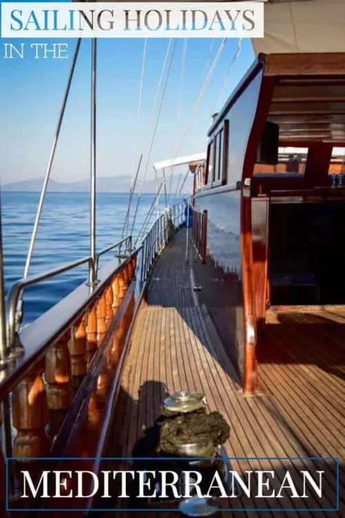 Looking down the side deck of a beautiful timber yacht in the Mediterranean. 