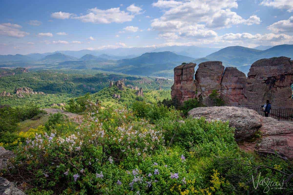 Green countryside rock formations of Balogradchick Bulgaria, blue sky and white clouds.