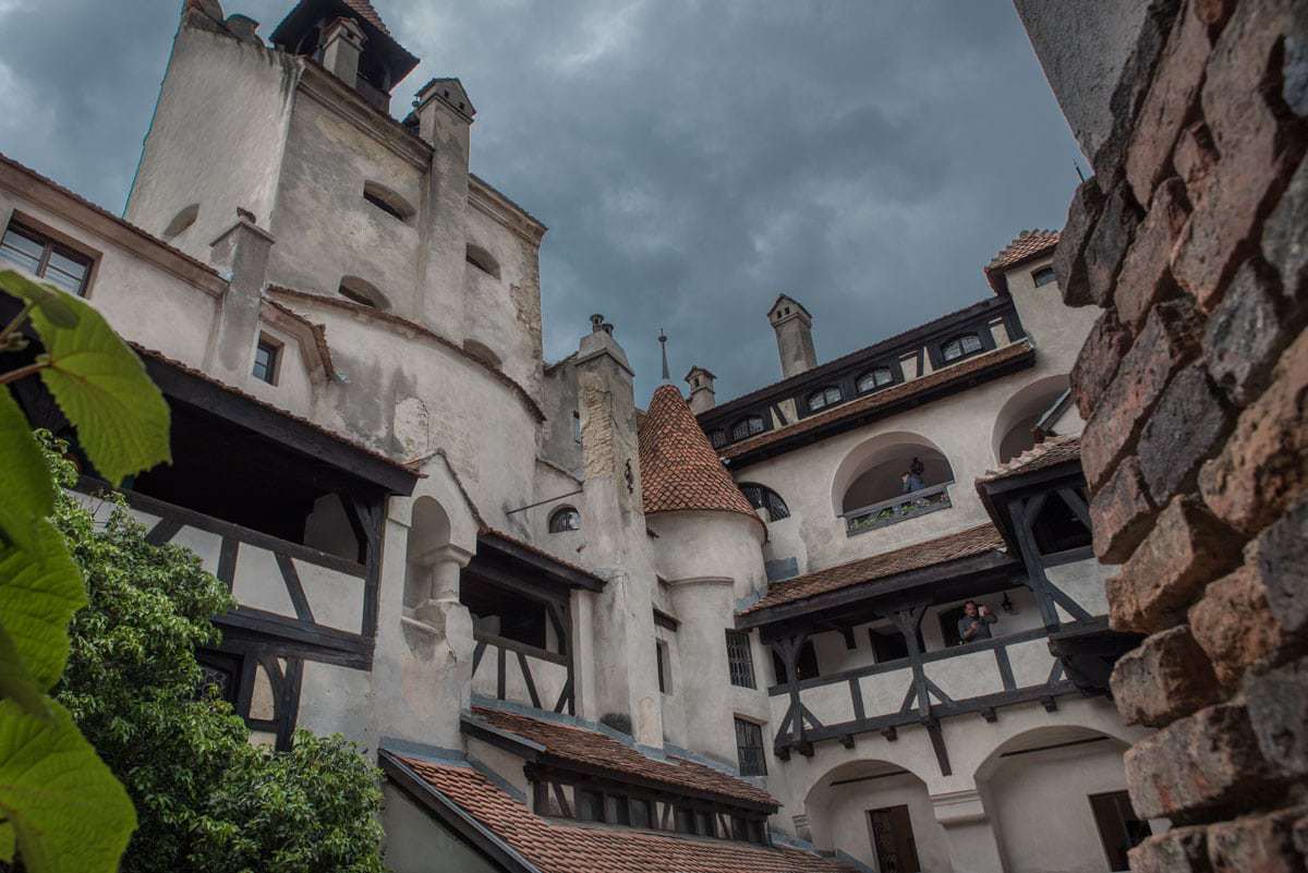The stormy skies enhance the eeriness of Bran Castle Transylvania Romania
