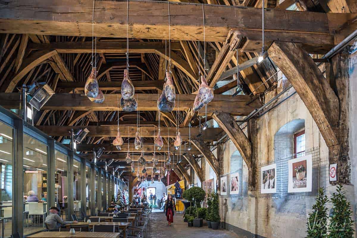 Free things to do in Ghent visit The Great Meat Hall with hams hanging from the giant wooden rafters of this grand old hall. 