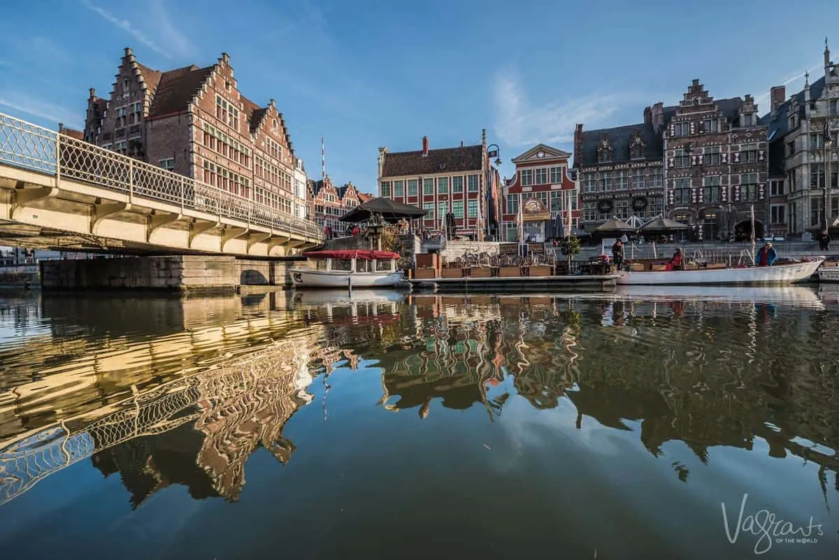 A bridge and building view from a Ghent Boat Tour or The Hop On Hop Off Water Tram, both of which are a great way to see this city. This is why visiting Ghent is one of the best things to do in Belgium