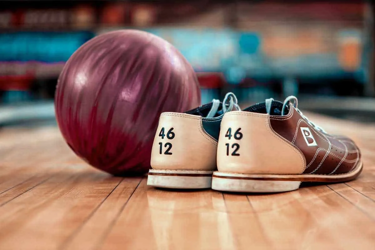 Pair of bowling shoes and a bowling ball. 