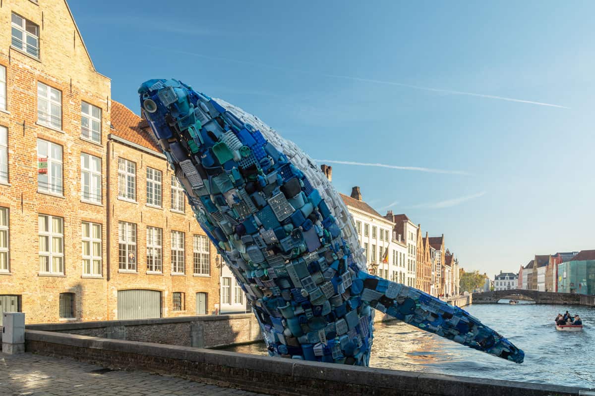 Large whale sculpture called the Skyscraper in the Bruges canals.