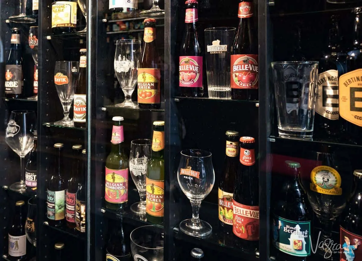 Belgian Beer with matching glasses on display on a shelf. 
