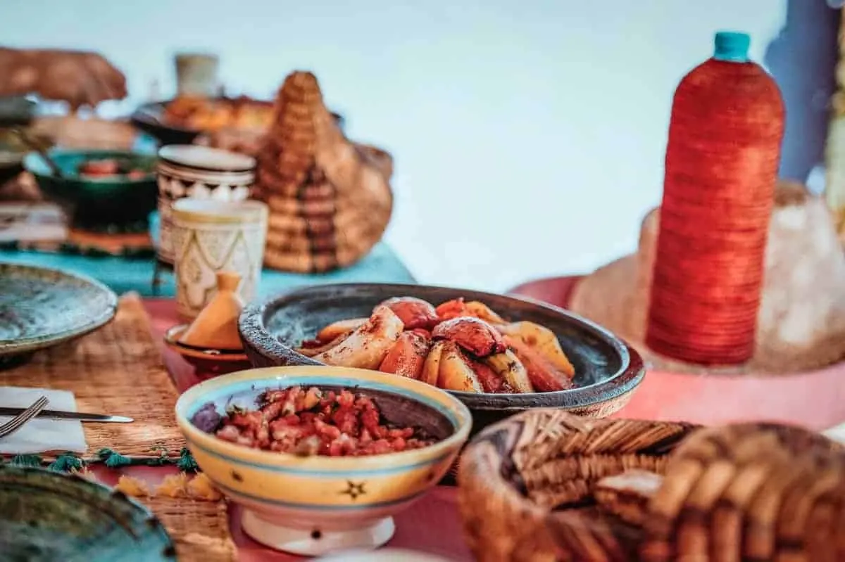 Moroccan food on a brightly coloured table. This is what a cooking class in Fez would be like