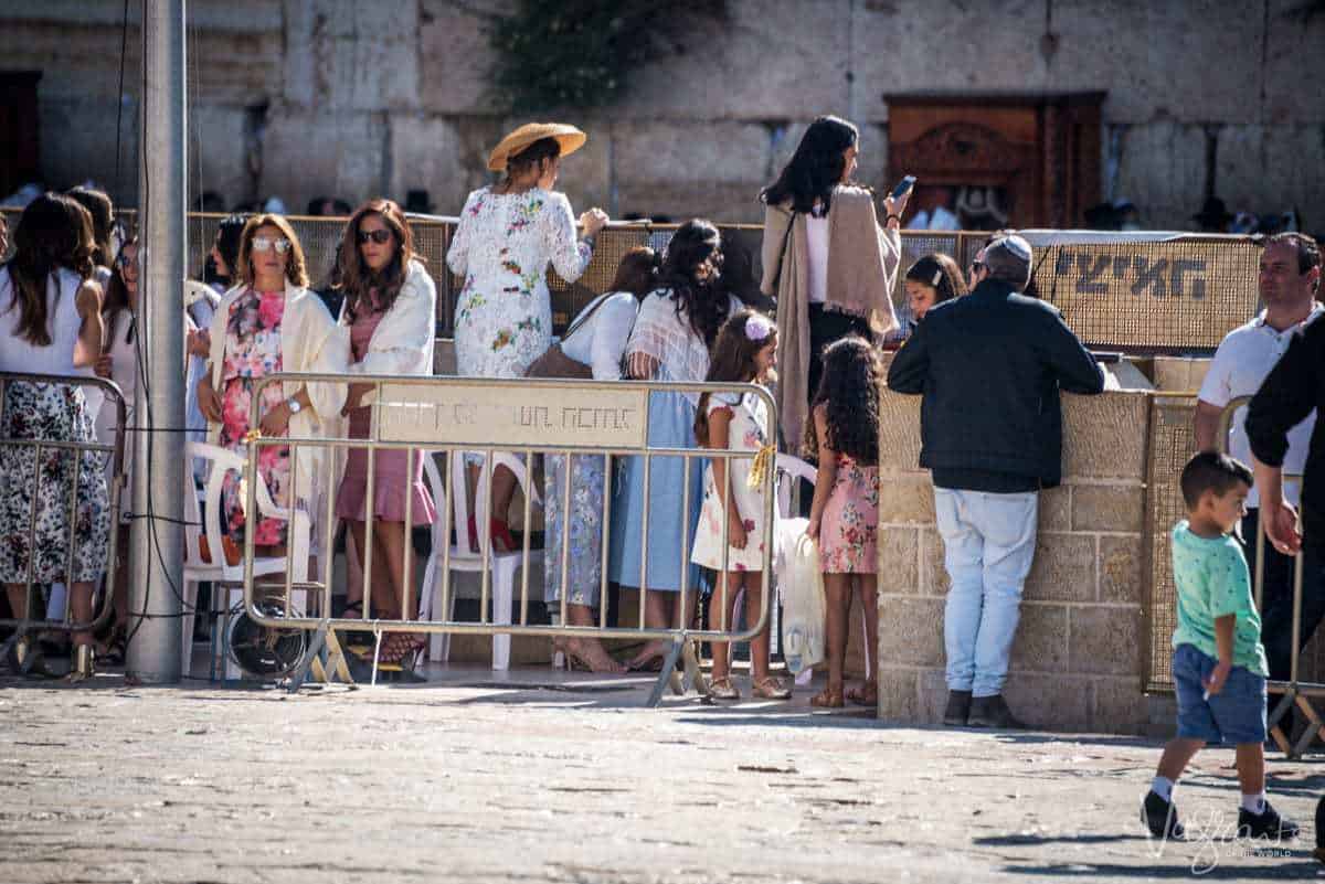 Women looking into the mens section at the Western Wall