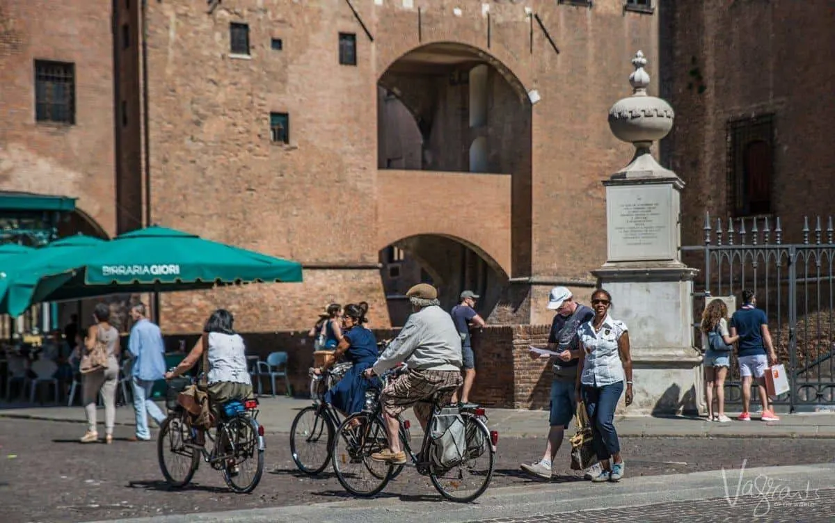 People walking in the ancient streets of Ferrara Italy.