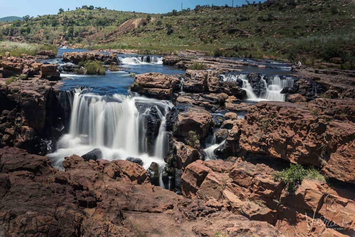 A ground level view of the water flowing across the rock formations at Bourke's Luck Potholes Panorama Route South Africa.