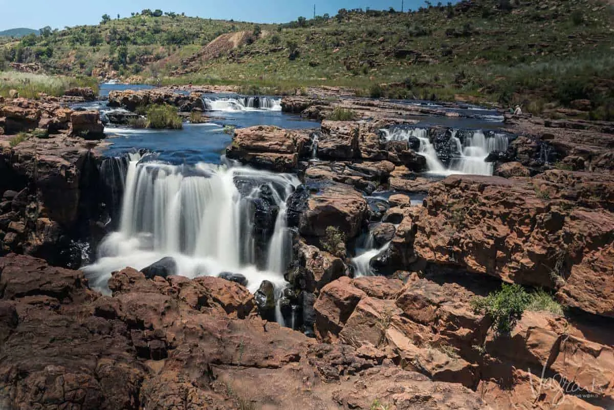 A ground level view of the water flowing across the rock formations at Bourke's Luck Potholes Panorama Route South Africa.