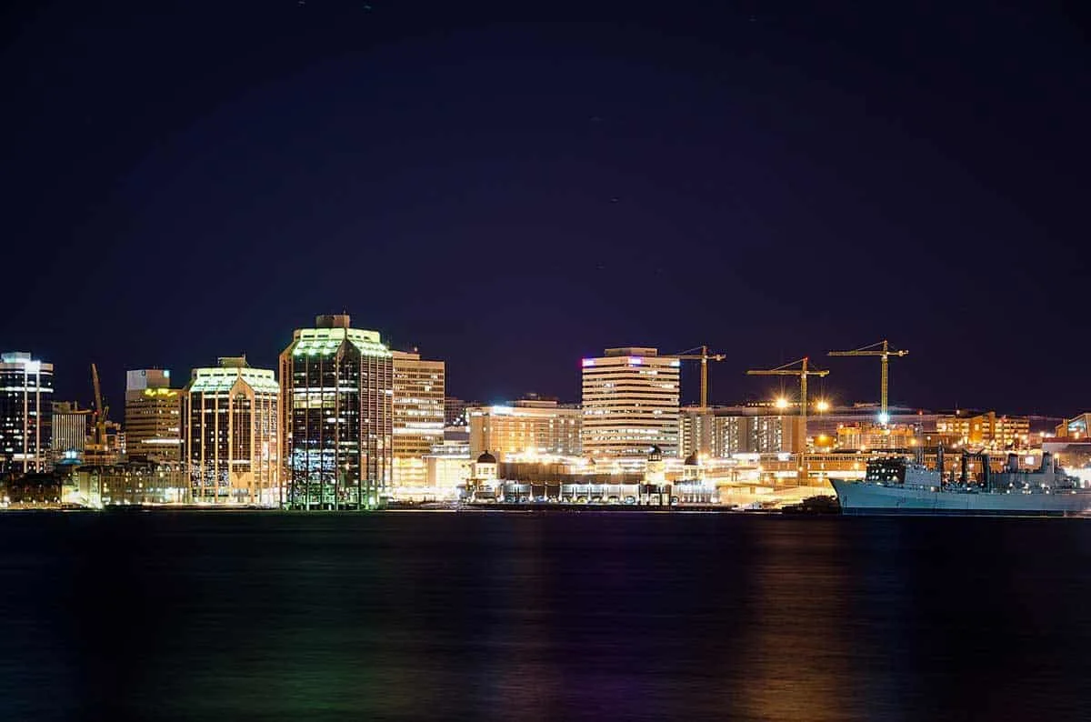 Looking across the water of the port towards the lit up city of Halifax. Best cities to visit in Canada - Halifax Nova Scotia
