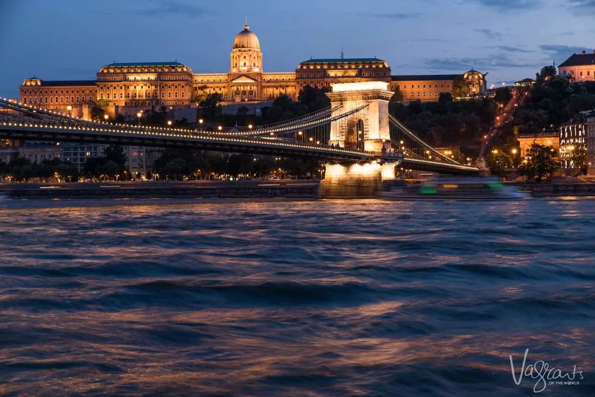 The parliament building in Budapest at night seen from the river. 