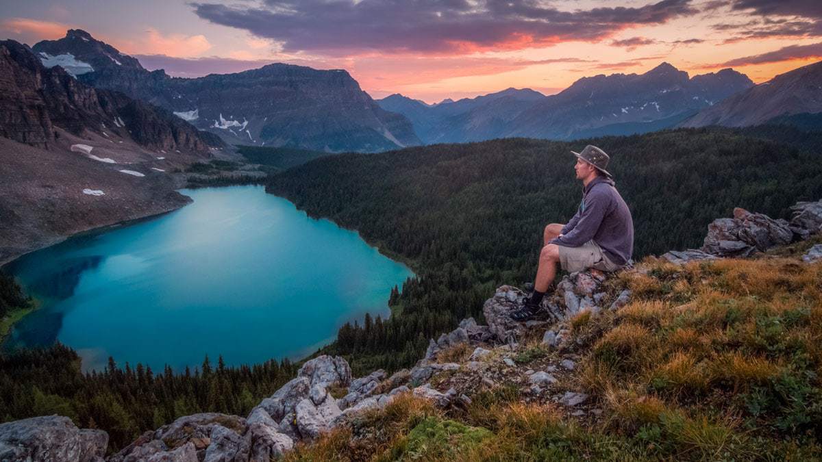 Hiker on a rock in Banff Canada.