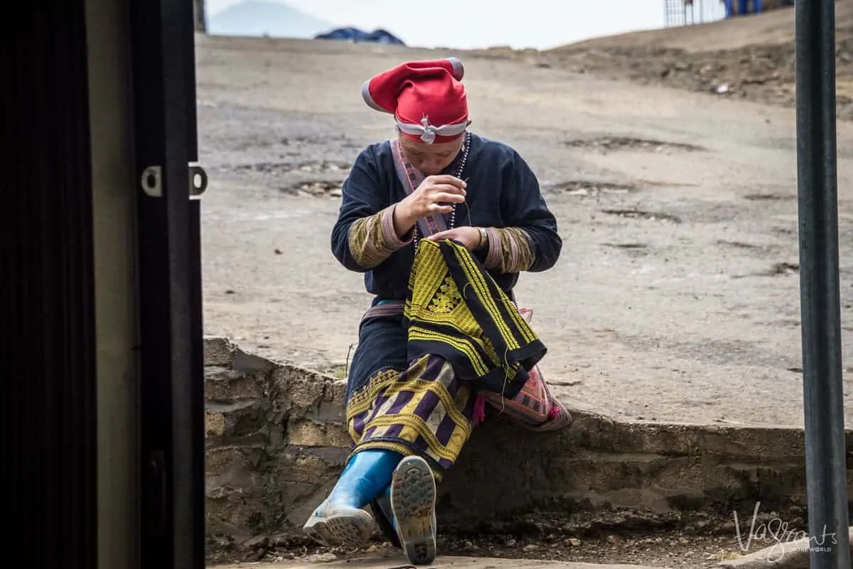 Local Lady sewing in Sapa Vietnam