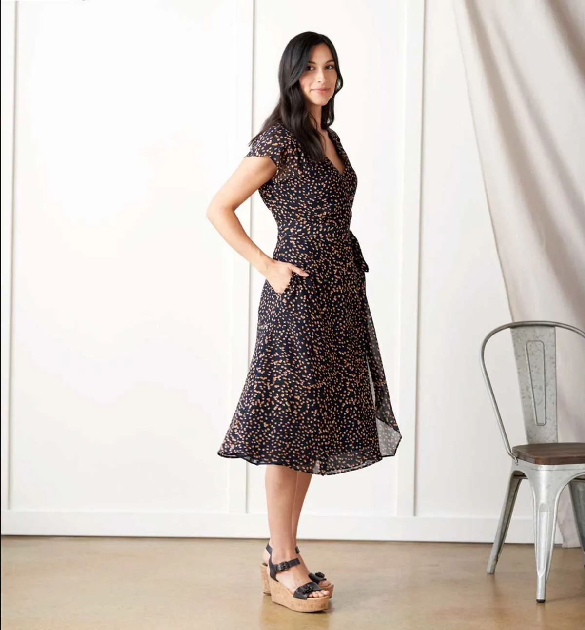 Woman modelling a spotted travel dress. 