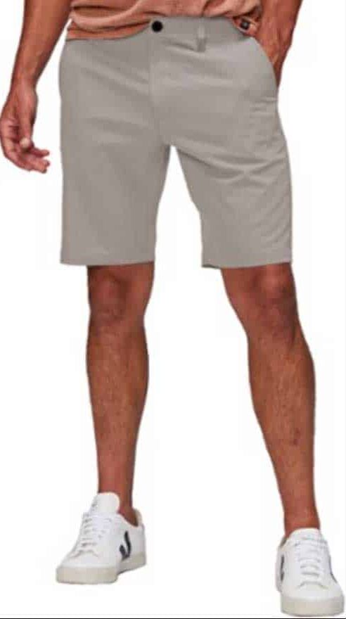 Man modelling light grey chino shorts.