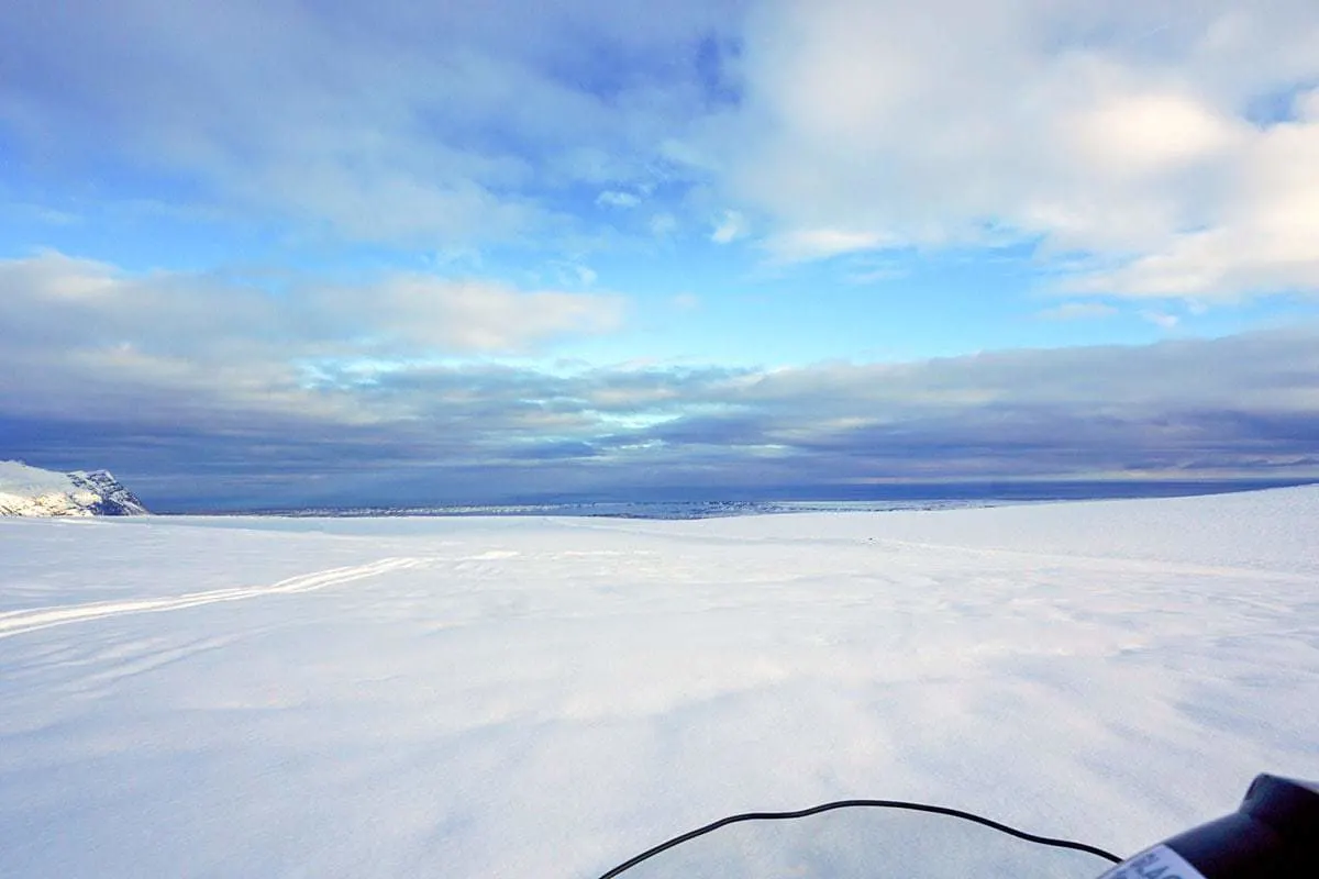 Horizon view of snow on a glacier - Snowmobiling on a glacier is one of the more extreme things to do in Europe in winter.