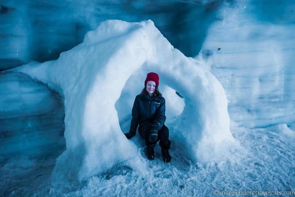 Girl sitting in the Langjökull ice tunnel in Iceland in winter