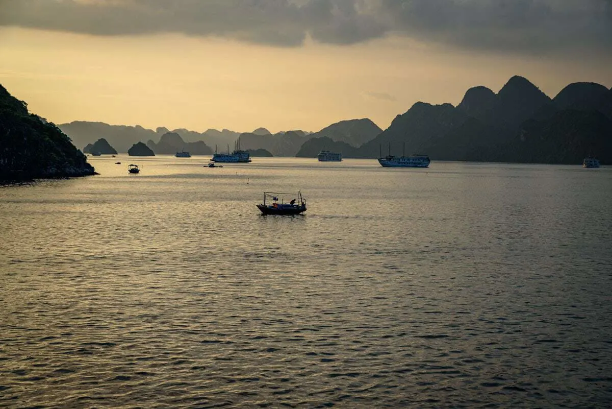 Sunset over Halong Bay is beautiful on a winter cruise