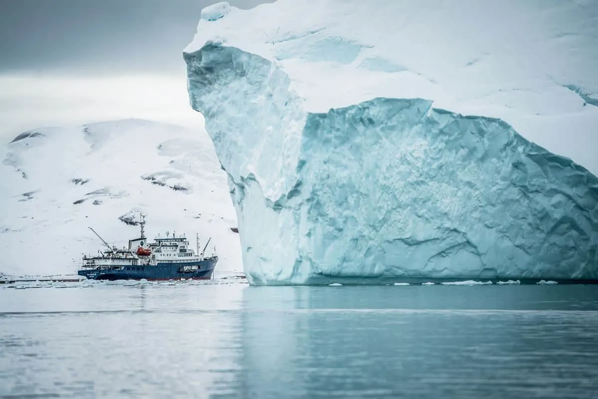 Sailing under icebergs in Greenland, the best winter cruise experience in the world.